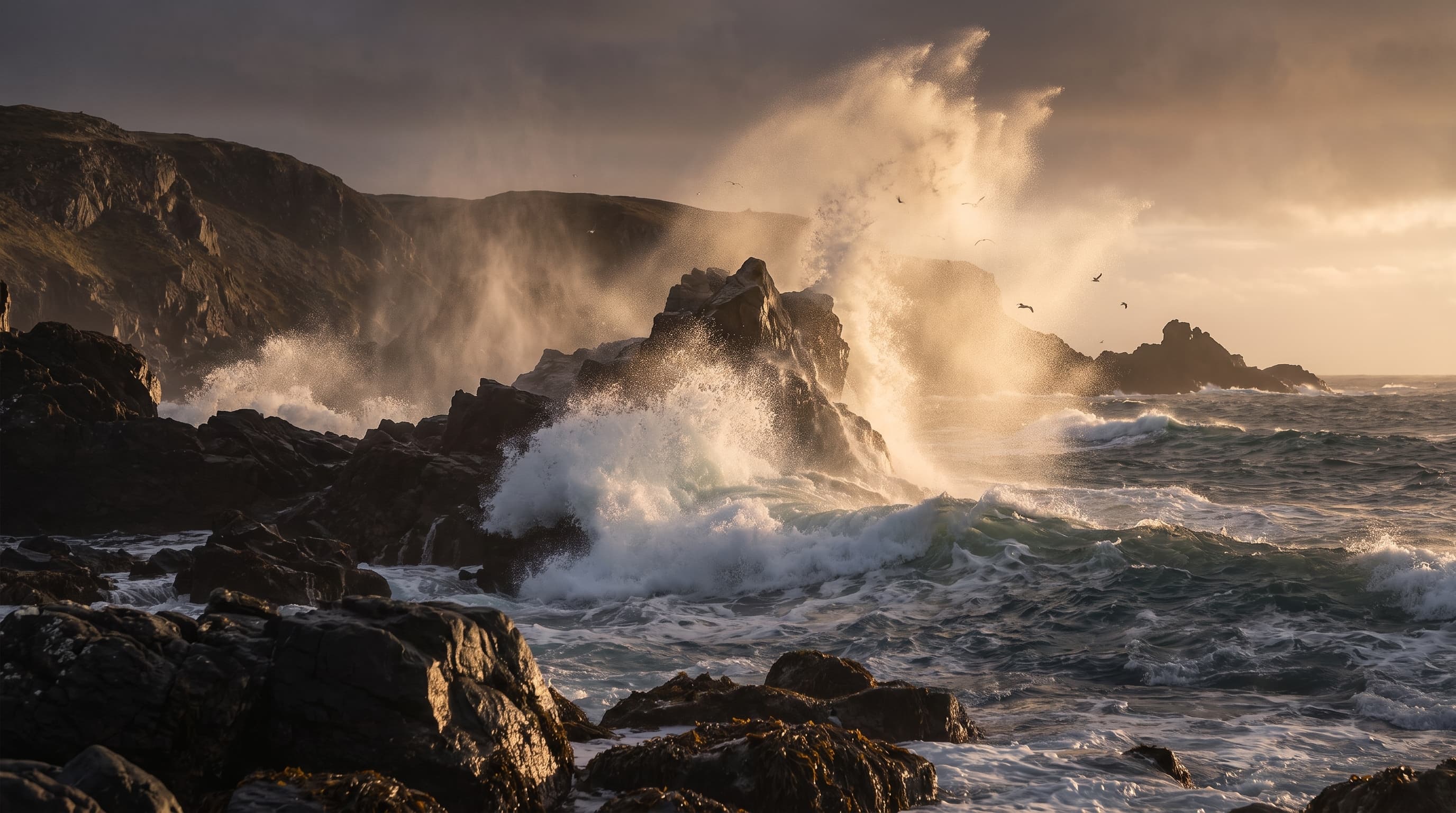 Sea spray breaking over a rocky North Atlantic coast